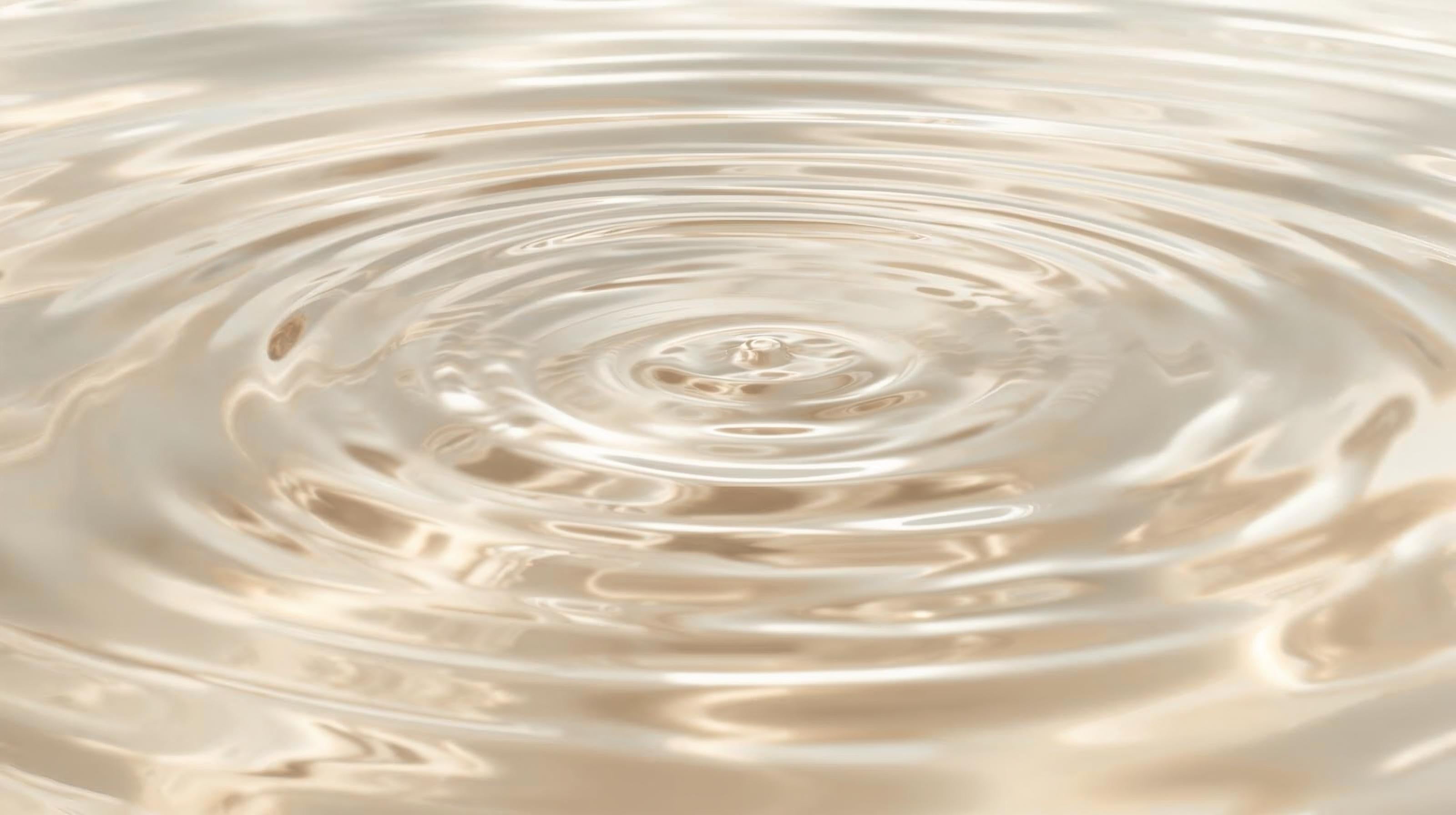 Ripple effect on a liquid surface with concentric circles.